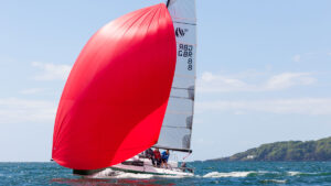 A Seascape 24 yacht with a red sail