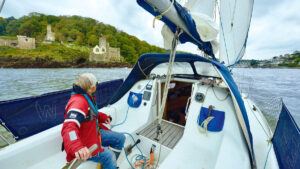 A man on a yacht sailing around the UK and ireland