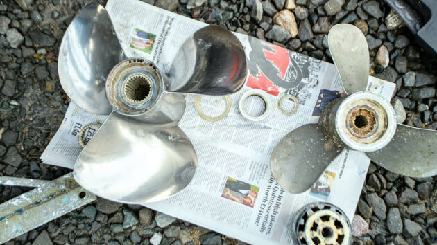 A gleaming boat propeller, dismantled for servicing