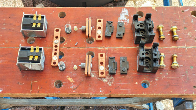 A boat bow thruster relay in bits on a workbench