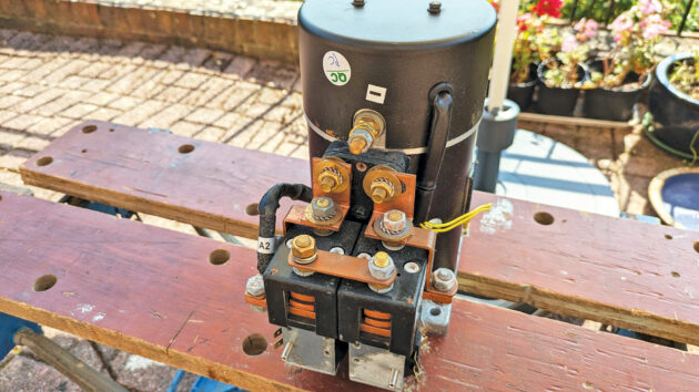 A boat bow thruster motor on a workbench