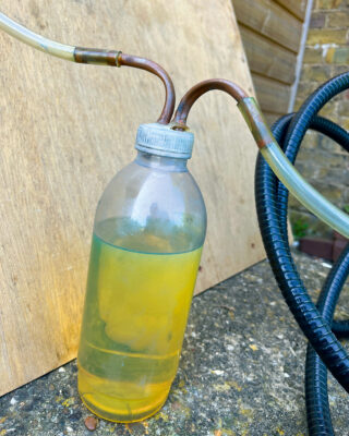Fuel being drawn to solve contaminated fuel problems on a boat