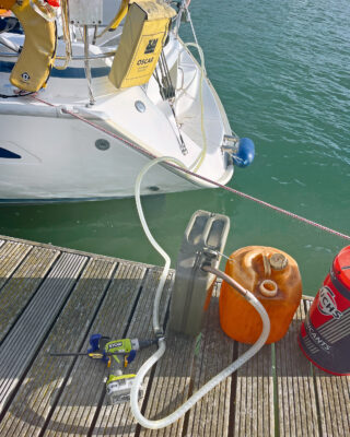 A pump being used on a boat to solve contaminated fuel problems