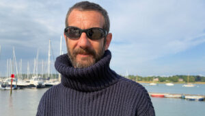 A man wearing an Arthur Beale Submariner jumper