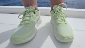 A person wearing a pair of Helly Hansen Crew Low sailing shoes