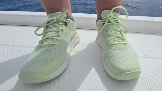 A person wearing a pair of Helly Hansen Crew Low sailing shoes