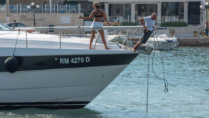 A couple trying to deal with a fouled anchor on their boat