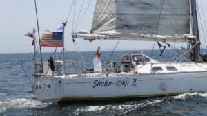 Japanese sailor Minoru Saito aboard his beloved yacht Shuten Dohji II. Credit: Takashi Ichige