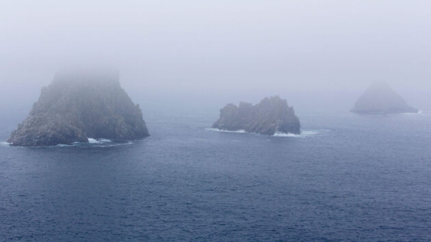 View of Ouessant (Ushant) island coast on a foggy day, France. Credit: deadlyphoto.com/Alamy