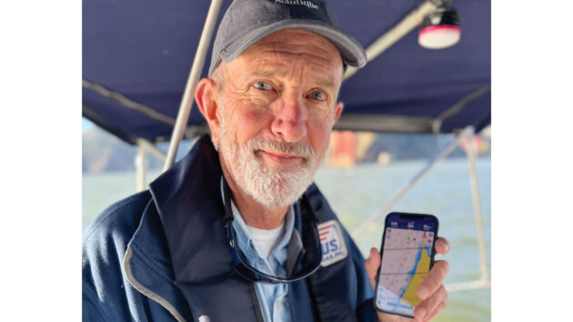 Paul Jones with a smartphone navigational app