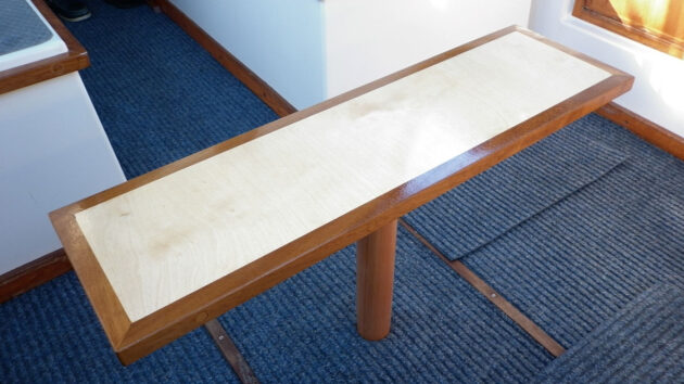 A table and pedestal support for wood for a boat berth