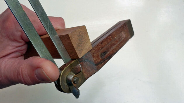 A man using a sliding bevel