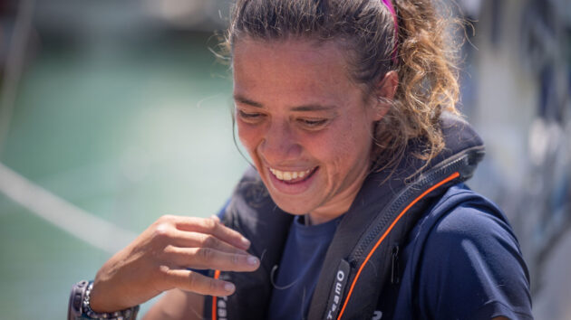Solo sailor Jazz Turner, first disabled person to complete a non-stop, unassisted circumnavigation of the UK and Ireland, smiles at the voyage finish at Brighton Marina. Credit: Fergus Kennedy