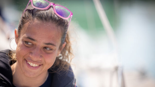 Solo sailor Jazz Turner, first disabled person to complete a non-stop, unassisted circumnavigation of the UK and Ireland, smiles at the voyage finish at Brighton Marina. Credit: Fergus Kennedy