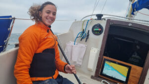 Sailor Jazz Turner at the helm of her Albin Vega 27 yacht Fear