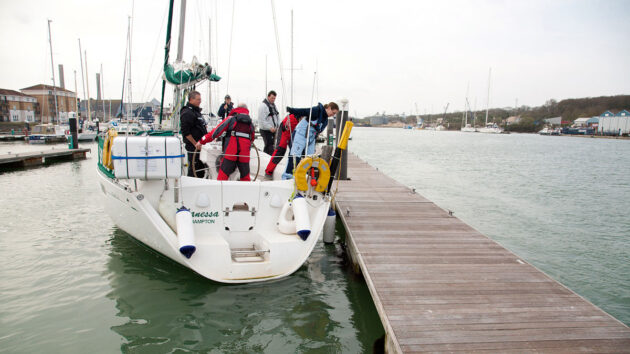 crew marina berthing a yacht against a pontoon