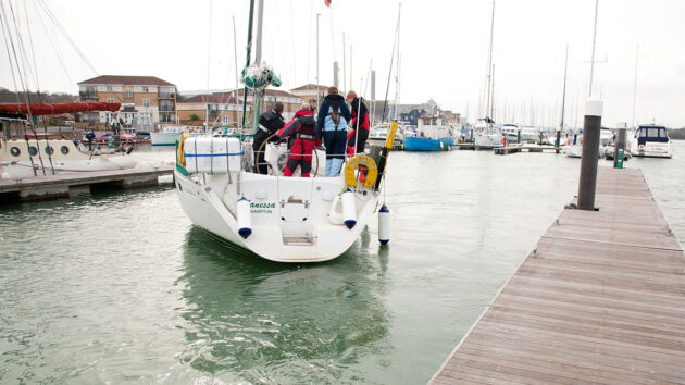 A yacht moving in a marina