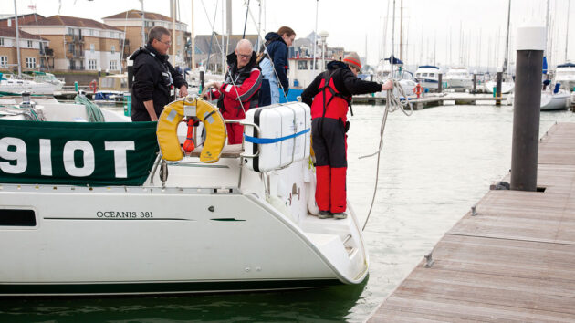 A boat reversing in a marina