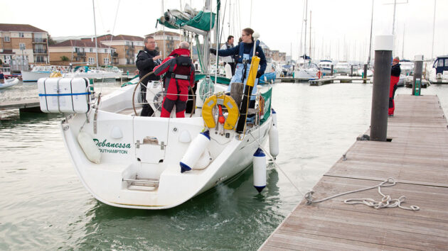 A yacht coming alongside during marina berthing