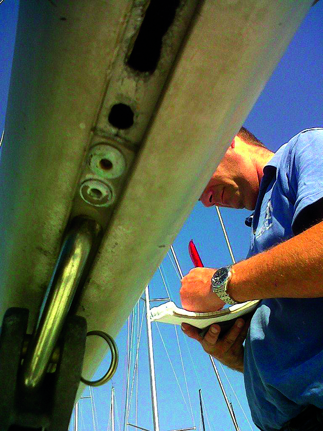 A man checking over a yacht