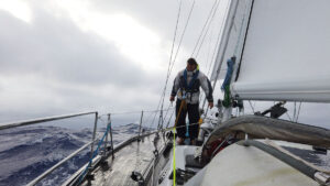 A man on a boat sailing offshore