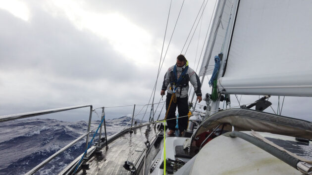 A man on a boat sailing offshore