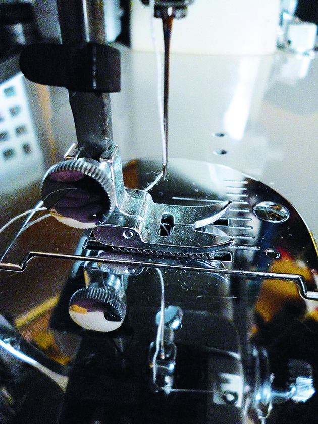 the needle of an old sewing machine