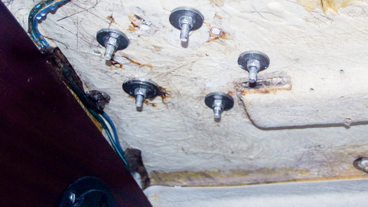 Penny washers being used to secure deck fittings to a boat