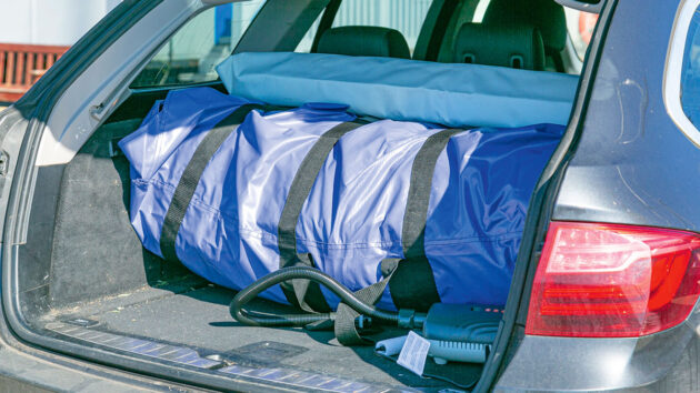 An inflatable boat in the boot of a car