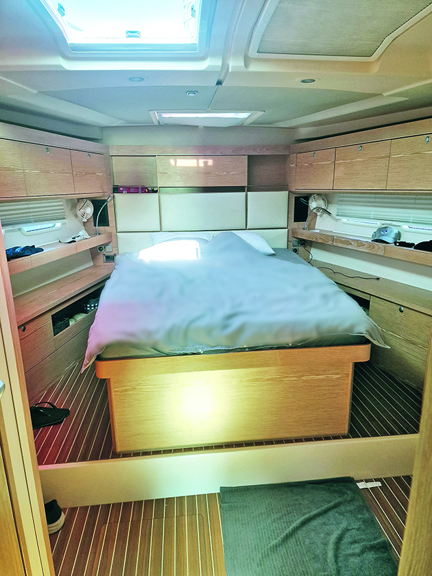 A Queen sized bed on a new boat