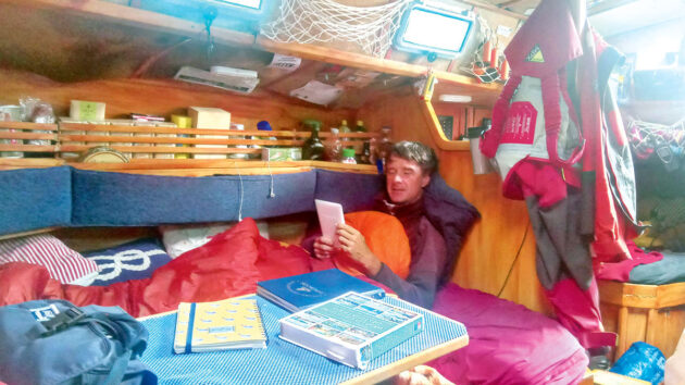 A man reading on a boat
