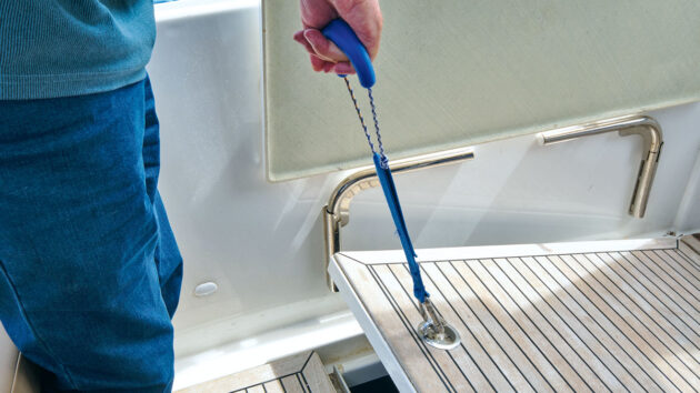 A bungee cord for opening a locker while sailing on a boat