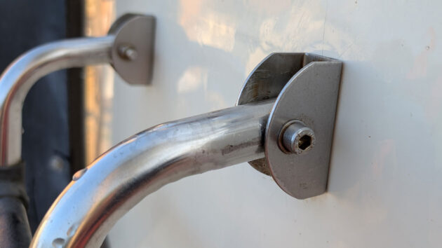 Metal bracket for a ladder on a boat