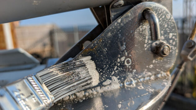 Super Stainless being applied with a brush to metal