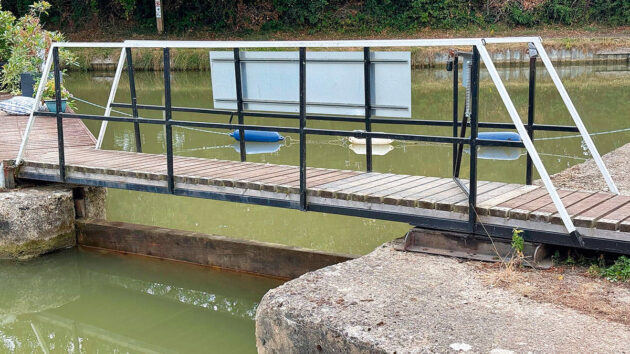The stop planks in place at the Crick Wharf Marina Ltd to “preserve what water we have”. Credit: Emma Green