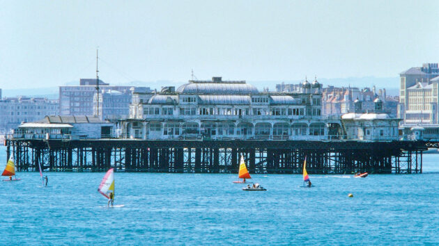 By the 1980s, windsurfing was a popular sport worldwide, here at West Pier, Brighton. Credit: parkerphotography/Alamy