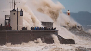 Waves crash against the harbour wall during Storm Brian at Porthcawl, South Wales on 21 October 2017. Credit: Matthew Horwood/Alamy