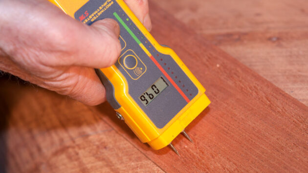 A moisture meter being used