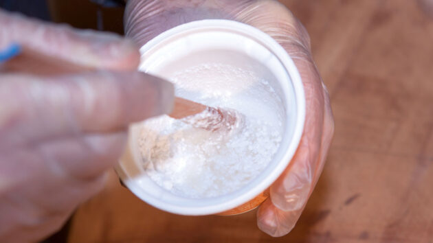 Epoxy being mixed during boatbuilding