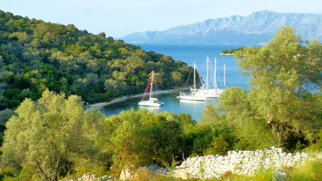 yachts moored off a Greek island