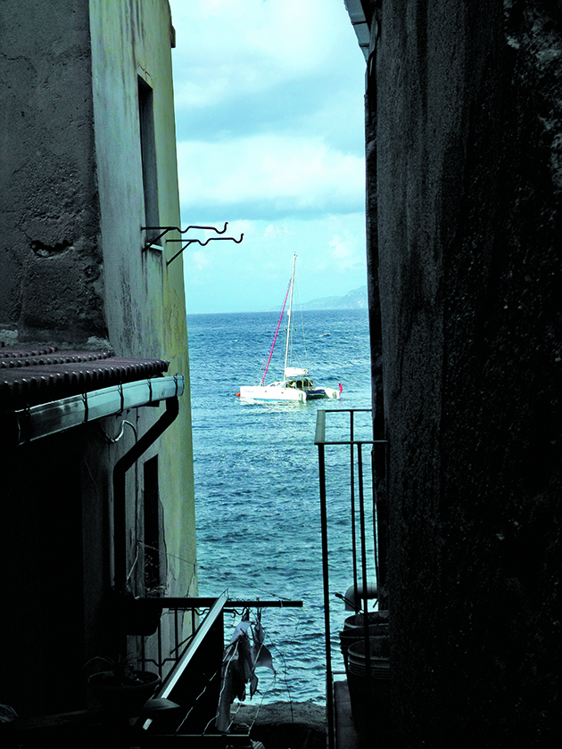 A catamaran sailing out to sea