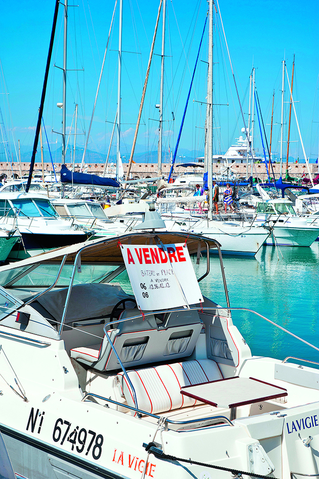 A boat with a for sale sign