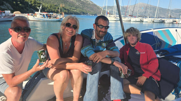 Four people on a boat during a charter holiday