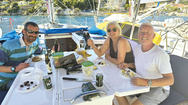 People eating lunch on a yacht during a charter holiday