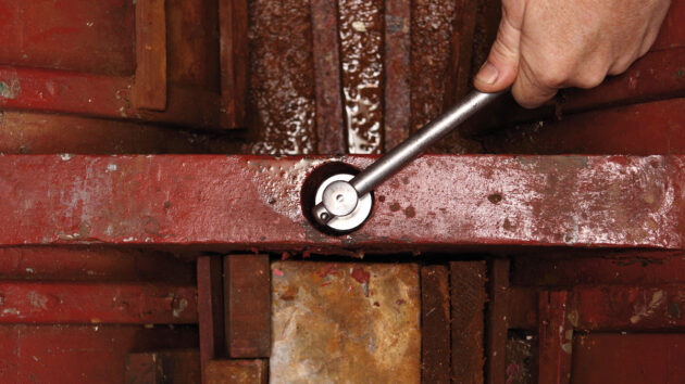A bolt being loosened during checking and replacing keel bolts