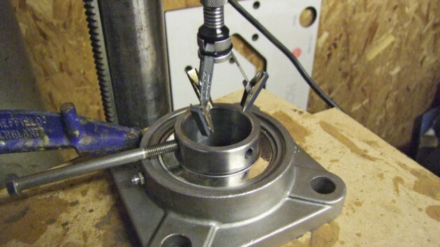 A bearing being ground