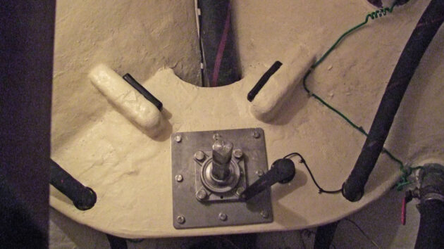 Rubber buffers being screwed into a boat