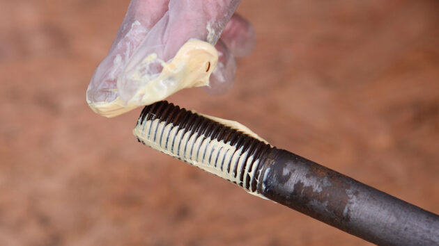 Lubricant being applied to a keel bolt