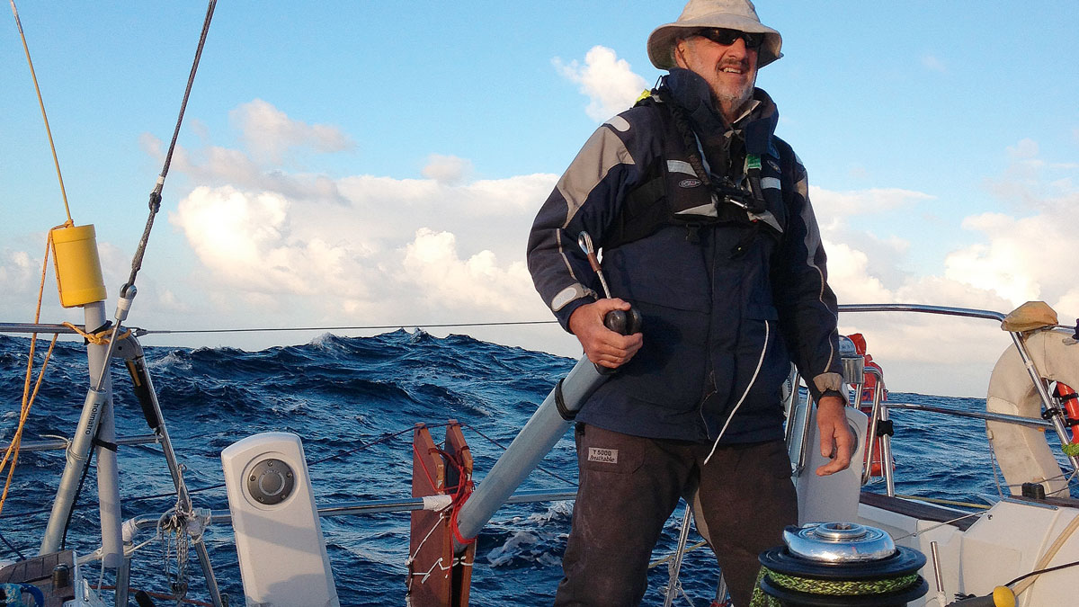 A man using a jury rudder to steer a boat