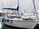A boat moored in a marina covered in snow